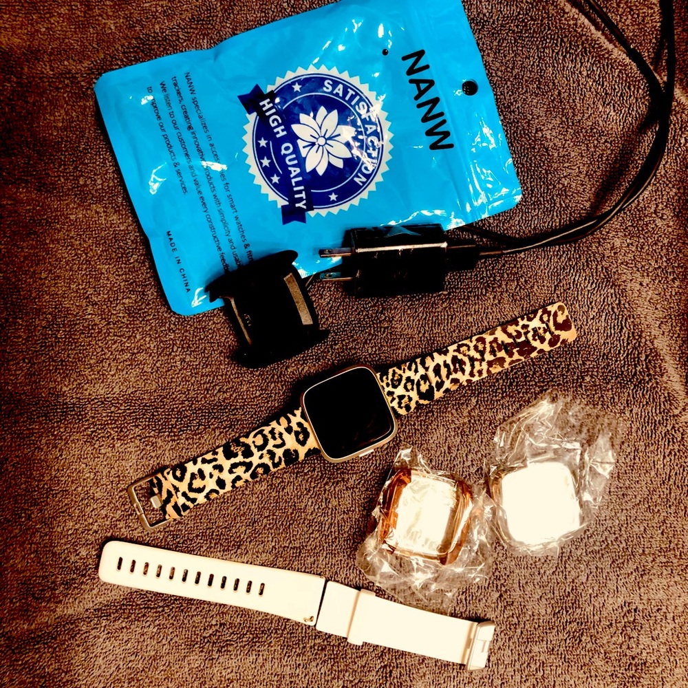 Fitbit Versa2 and accessories. (Extra watch band and two cover plates)
